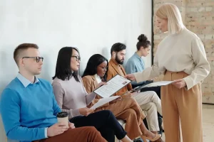 hr-manager-giving-clipboard-with-questionnaire