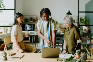 three-diverse-managers-coworking-in-office